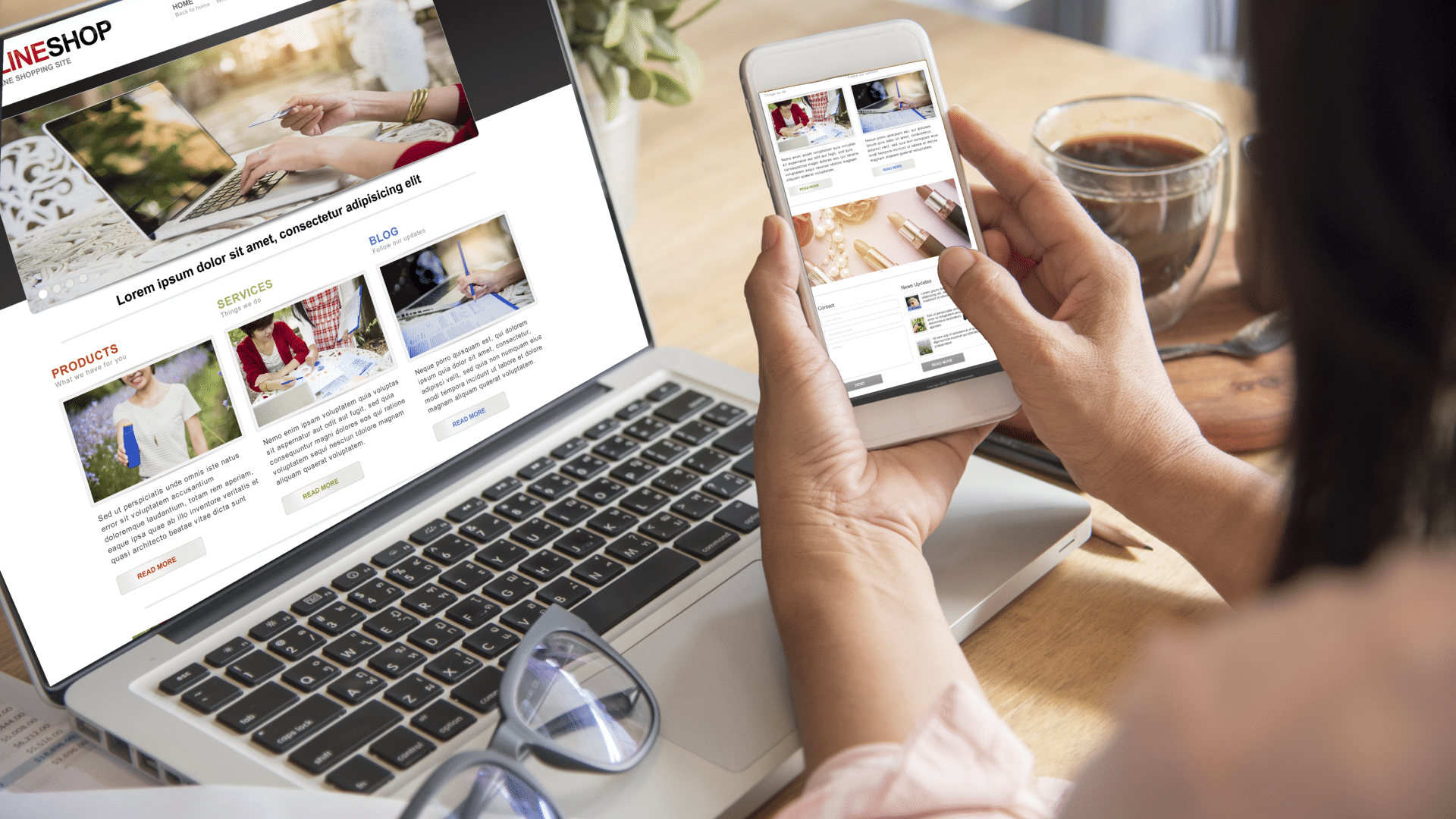 a person reads an online news article on a laptop and smartphone