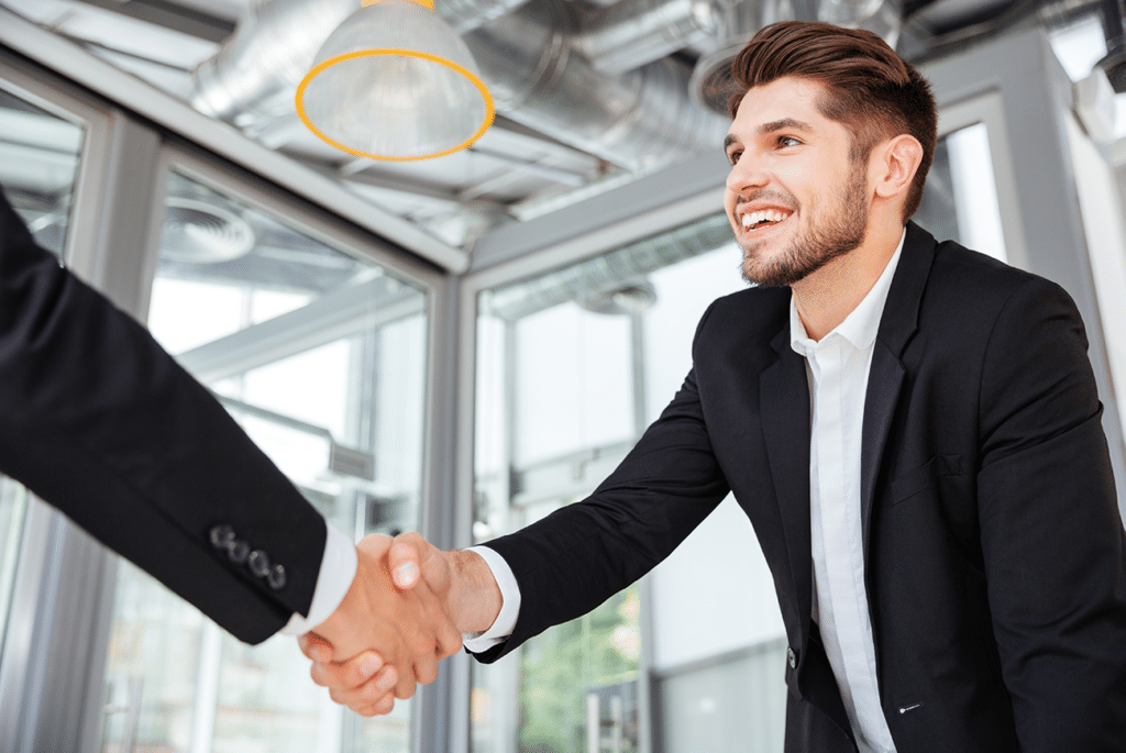Two successful businessmen shaking hands