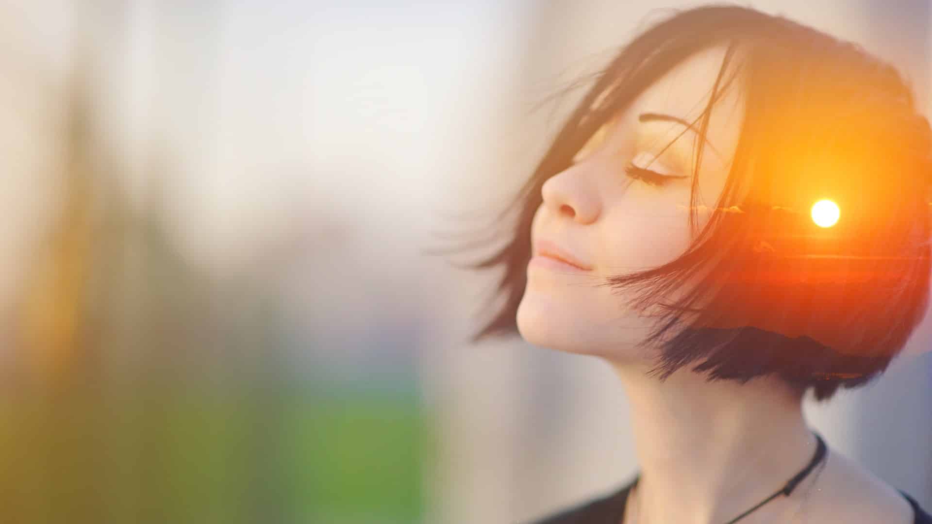 a woman has sunset on her head to symbolize deep thinking