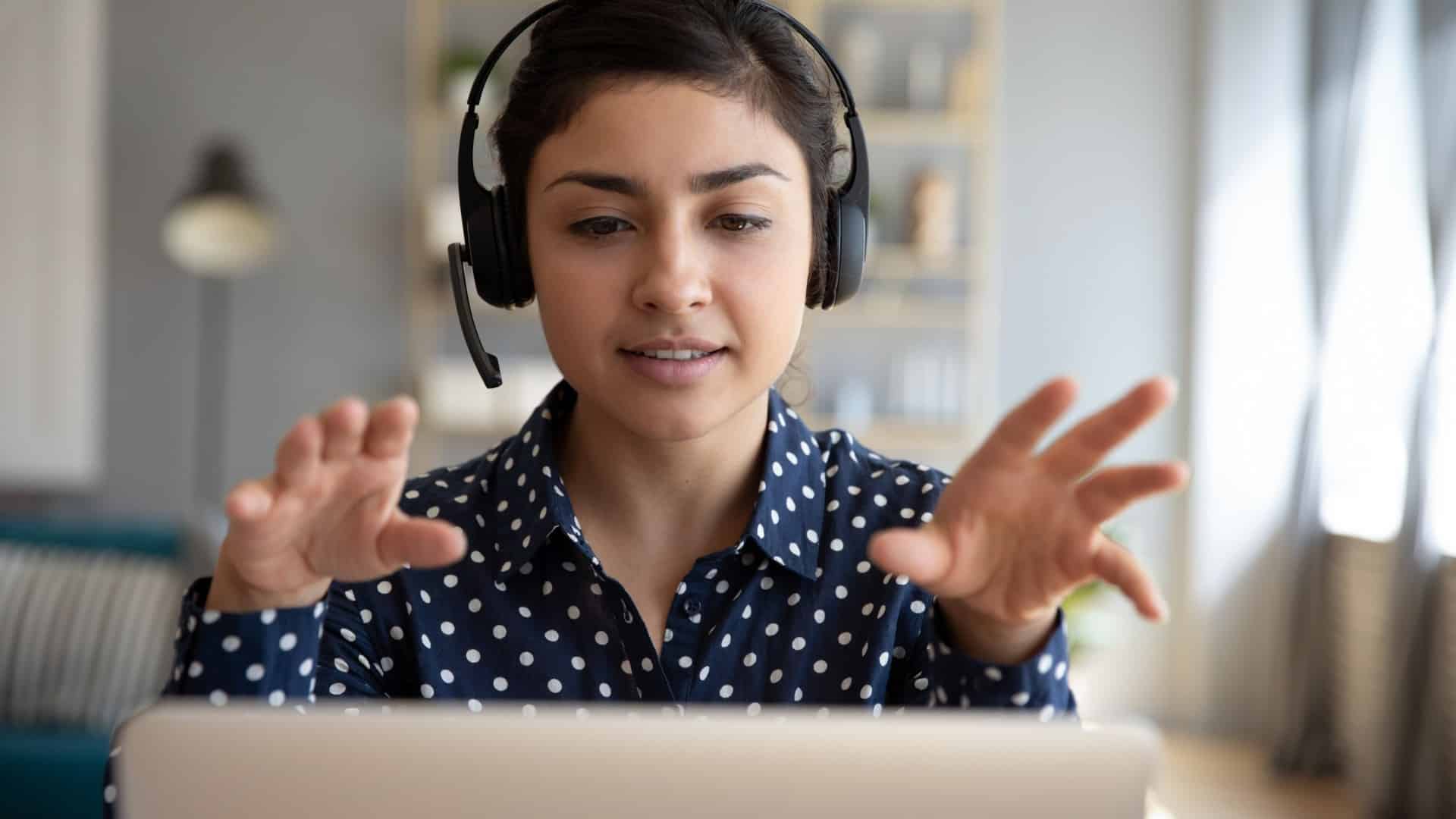 a woman with a headset talks on her webcam about cultivating brand ambassadors